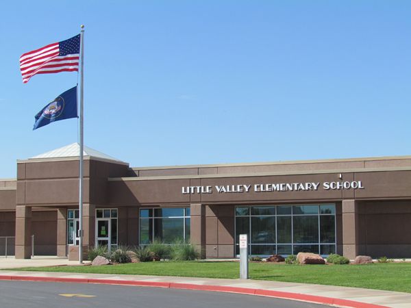 Front of school with US and Utah flag